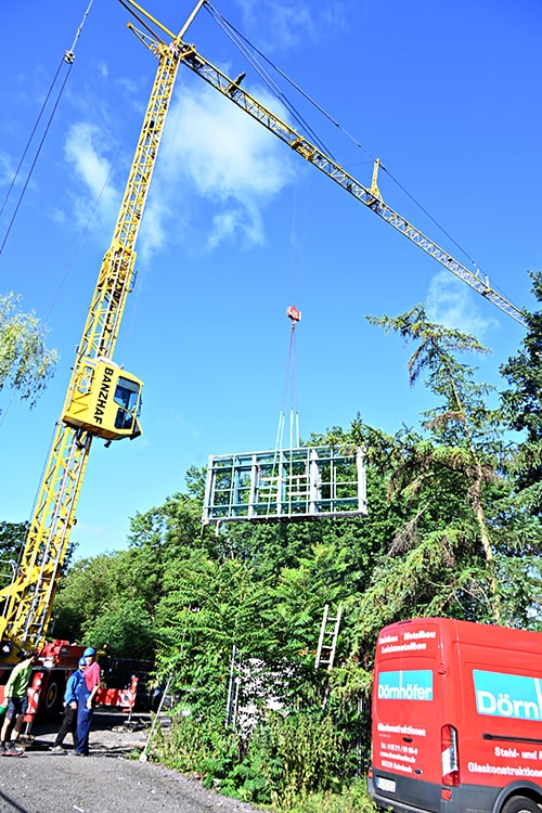 Baustelle Paracelsus-Bad mit Kran und Bauarbeitern